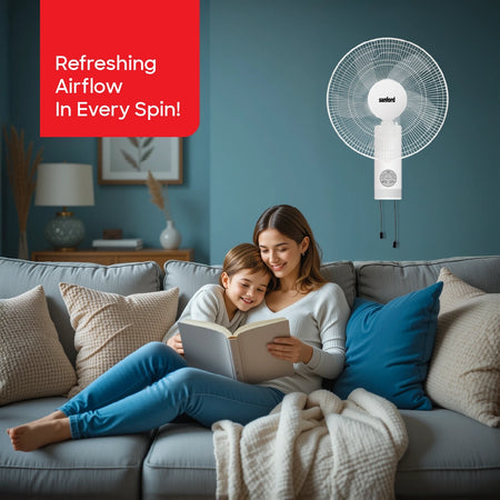 Sanford Wall Fan 16 Inch with Remote – lifestyle shot of man on sofa controlling the wall fan with remote